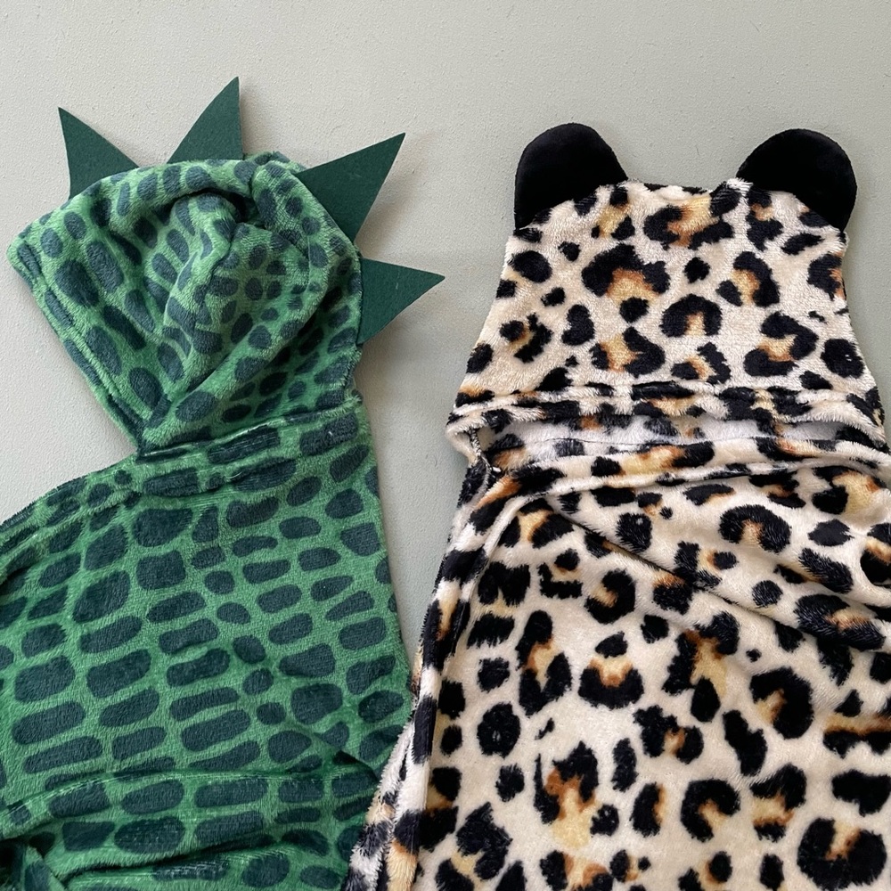 Two children’s animal print bath throws with hoodies